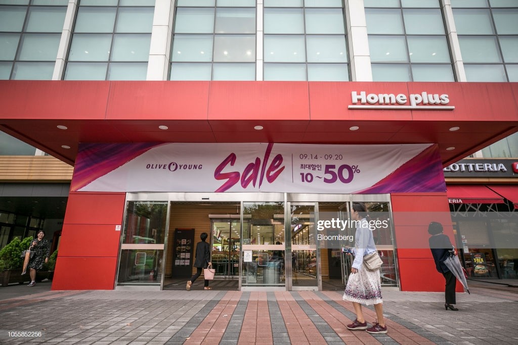 Pedestrians walk past a Homeplus Co. store in Seoul, South Korea, on Thursday, Sept. 20, 2018. Lim Il Soon became the chief executive officer of Homeplus, a $9.7-billion-a-year discount-store operator, in 2017 after she built a reputation among buyout funds for being a turnaround wizard. Prior to that, she had been chief financial officer at four companies since 1998, a rarity in a country with the lowest female representation in the OECD. Photographer: Jean Chung/Bloomberg via Getty Images