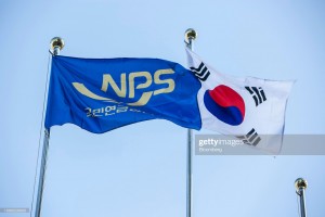 The flags of South Korea, right, and its National Pension Service (NPS) fly outside the pension fund's headquarters in Jeonju, South Korea, on Thursday, Nov. 22, 2018. The NPS is looking at boosting alternative investments abroad as weak returns domestically and slumping stock markets globally are forcing the world's third-largest pension fund to seek higher yields. Photographer: Jean Chung/Bloomberg via Getty Images