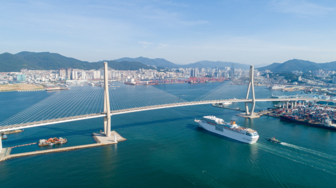 Cruise passing under Busan Harbor Bridge