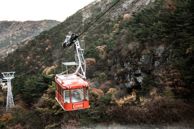 While on a red cable car, I was able to see beautiful mountain terrain, Geumosanseong Fortress, and even downtown Gumi far below.