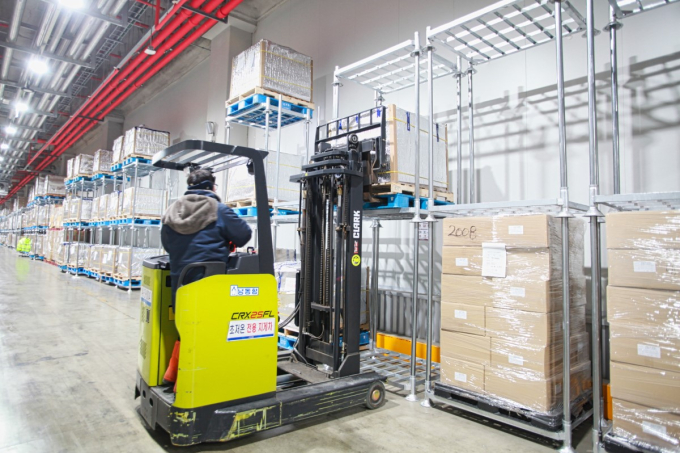A Korea Superfreeze employee transports frozen goods