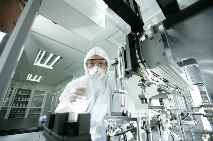 Posco Chemical researcher runs quality tests on battery cells
