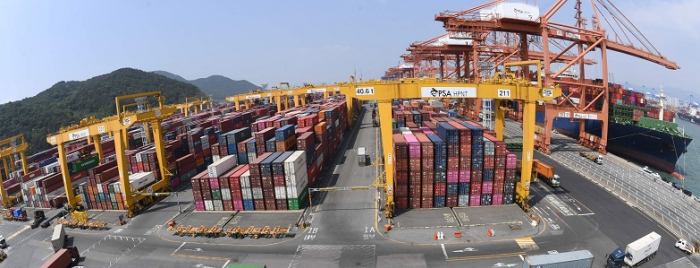 Piles of container boxes waiting to be shipped in the port of Busan, South Korea