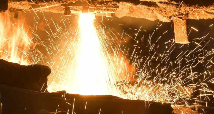 Scrap metal melting at furnaces.