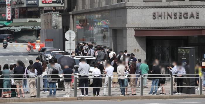 A long line of people waiting for the luxury brand outlet to open at Shinsegae department store.