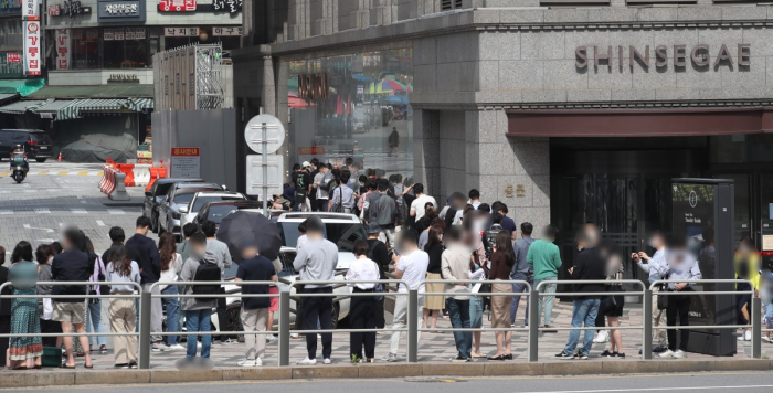 South Africans queue outside Louis Vuitton daily, but African