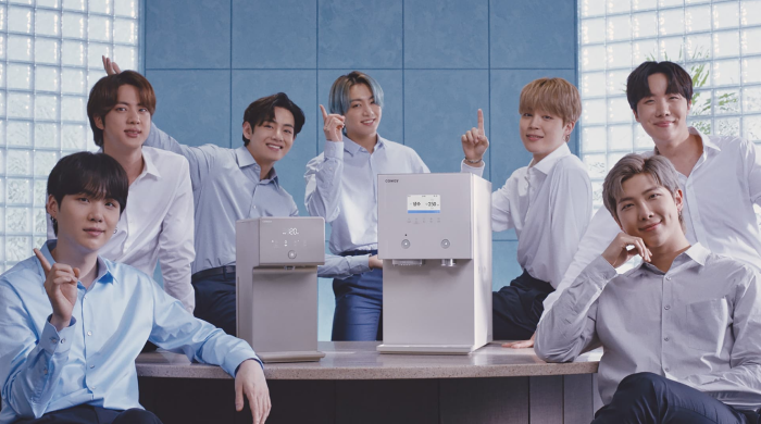 BTS members with Coway water purifier products.