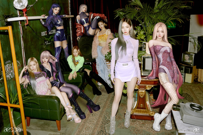 Each of the four aespa members with her virtual avatar.