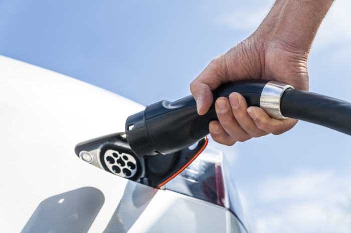 Charging an electric vehicle.