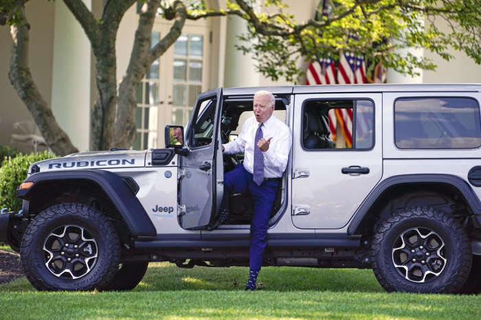US President Joe Biden gets out of a Jeep Wrangler Rubicon 4xE during an event on clean cars and trucks, on the South Lawn of the White House, on Aug. 5.