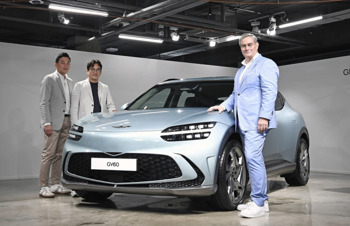 Genesis Chief Brand Officer Luc Donckerwolke (right) and other officials at the GV60 online premiere