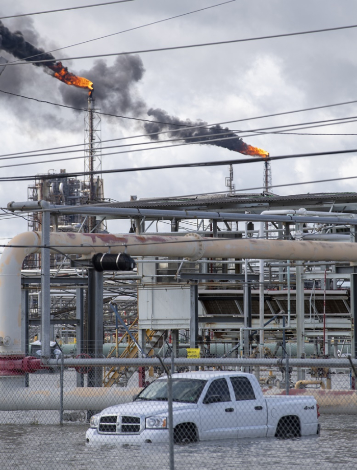 Floodwater fills an area at a refinery where flaring was taking place the morning after Hurricane Ida in Norco, Louisiana, on Aug. 30, 2021
