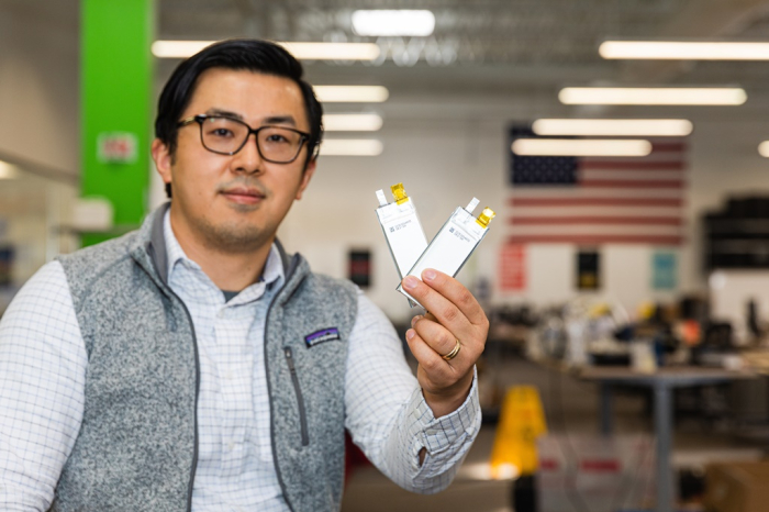 SES founder and CEO Qichao Hu displays prototypes of lithium-metal batteries earlier this year (Courtesy of SES)