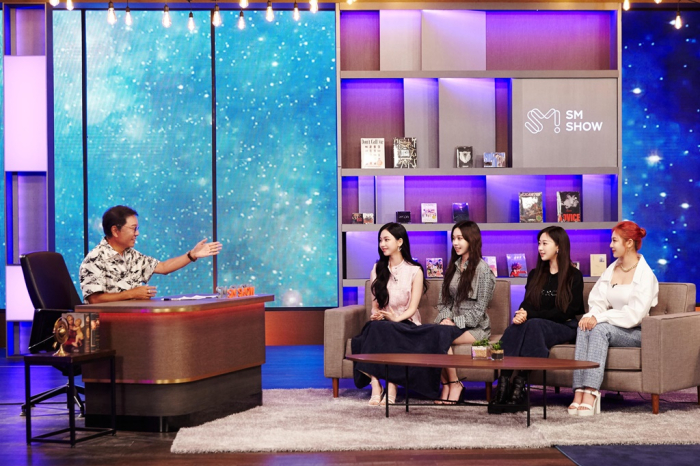 SM　Entertainment　founder　and　chief　producer　Lee　Soo-man　(left)　hosts　girl　group　Aespa　on　his　talk　show　in　June　(Courtesy　of　SM　Entertainment)