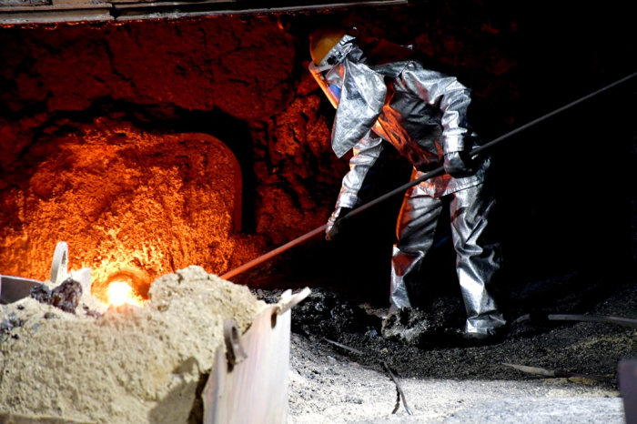 A POSCO employee tends to company's No. 1 blast furnace for the last time