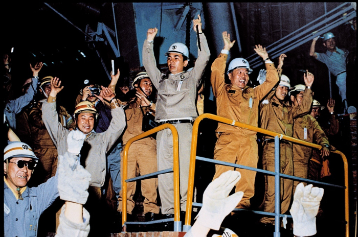 Park Tae-joon (middle), the late honorary chairman of POSCO, and other key founding members of the company celebrate on June 9, 1973, when the No. 1 blast furnace starts producing molten iron
