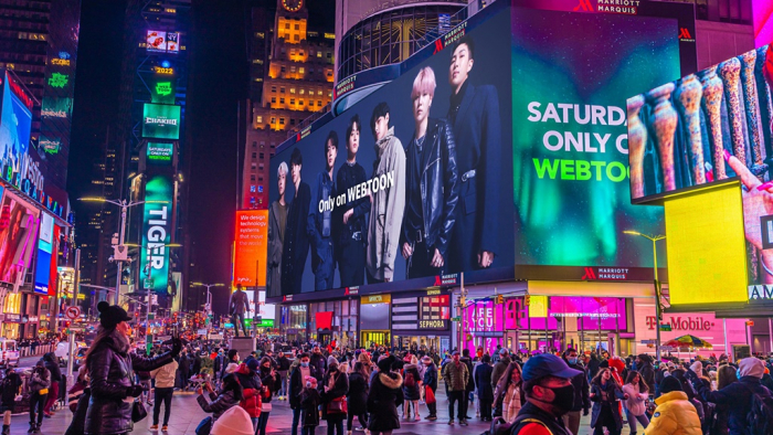Naver　Webtoon　showcases　a　supersized　digital　advertisement　of　HYBE’s　new　webtoon　and　web　novel　“7　Fates:　Chakho,”　which　features　BTS,　in　Times　Square,　New　York　(Courtesy　of　Naver　Webtoon)