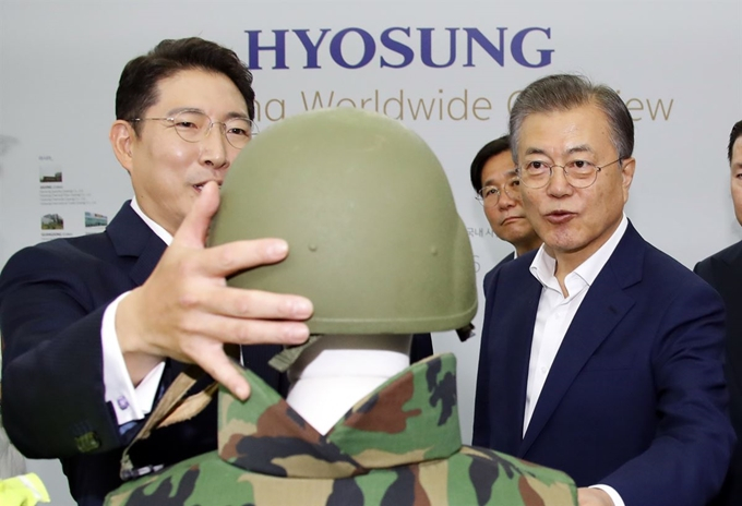 Hyosung Chairman Cho Hyun-joon (left) with South Korean President Moon Jae-in at Hyosung Advanced Materials plant