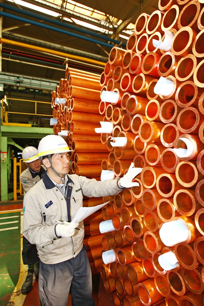 Piles of copper pipes at a Poongsan plant in Ulsan, South Korea
