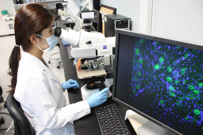 A Kolon Life Science researcher works on drug experiments at the company’s R&D center