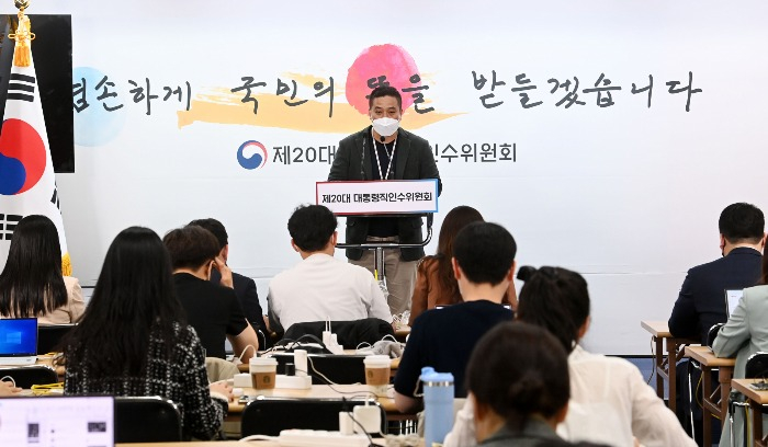 Ko San, a member of the presidential transition committee, speaks on April 26