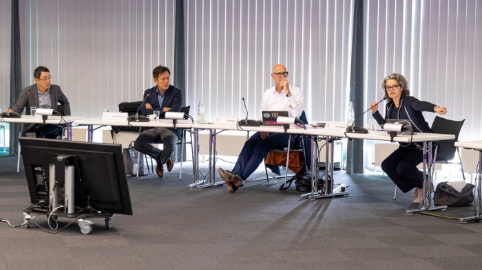 SK Telecom CEO Ryu Young-sang (from left), SK Square Vice Chairman Park Jung-ho, Deutsche Telekom CEO Timotheus Höttges and its board member for technology and innovation Claudia Nemat discuss partnerships on various businesses in Europe on May 5, 2022, at the German telecommunication giant’s headquarters in Bonn (Courtesy of SK Telecom)