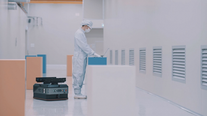 An SFA Engineering employee tests an automated guided vehicle