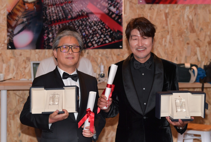 Director Park Chan-wook (left) of Decision to Leave and actor Song Kang-ho of Broker won the Best Director and Best Actor awards, respectively, at the 75th Cannes Film Festival