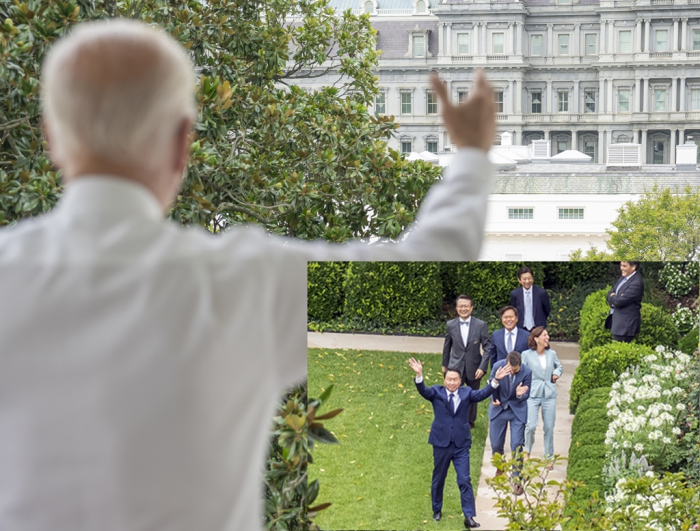 US President Joe Biden waves at visiting SK Group Chairman Chey Tae-won at the White House. The two met through a video conference call as Biden continues to recover from COVID-19.