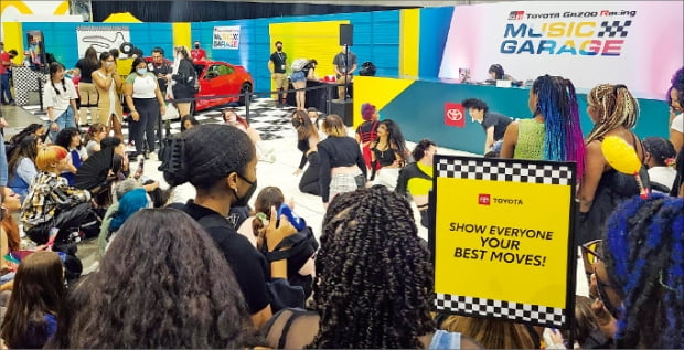 K-pop fans dance in front of Toyota’s booth at the LA Convention Center