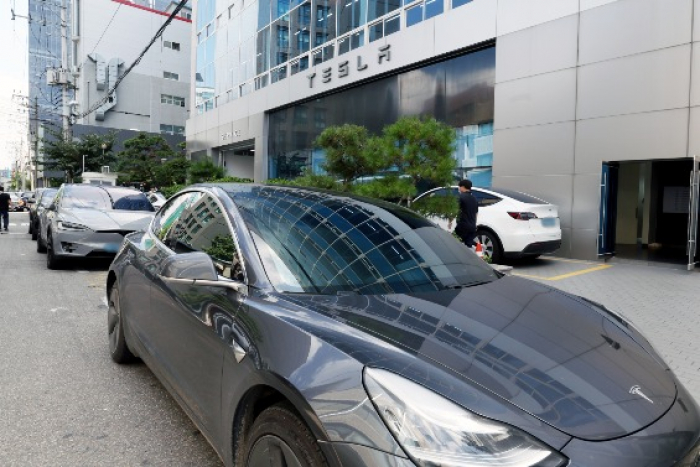 Cars lined up outside Tesla's after-sales service center in Seoul on Aug. 23, 2022