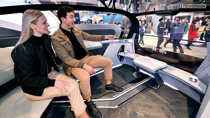 Visitors　sit　inside　Hyundai　Mobis'　M.Vision　S,　a　future　mobility　concept