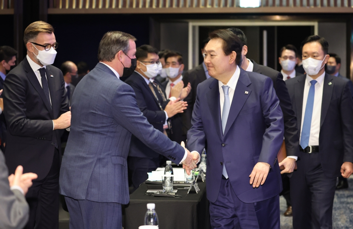 Luxembourg's Crown Prince Guillaume Jean Joseph Marie (left) shakes hands with South Korean President Yoon Suk-yeol at an event to declare the Asian country’s future space economy roadmap on Nov. 28, 2022