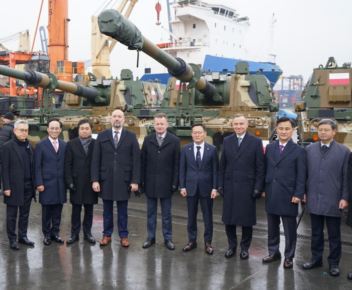 Government officials and business leaders at a ceremony for the arrival of Hyundai Rotem's K2 Black Panther tanks in Poland on Dec. 7, 2022