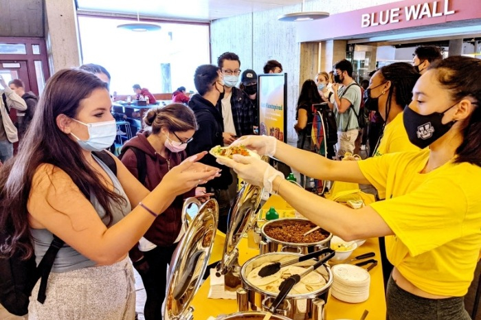 Students and staff of the University of Massachusetts Amherst try Pulmuone's plant-based meat
