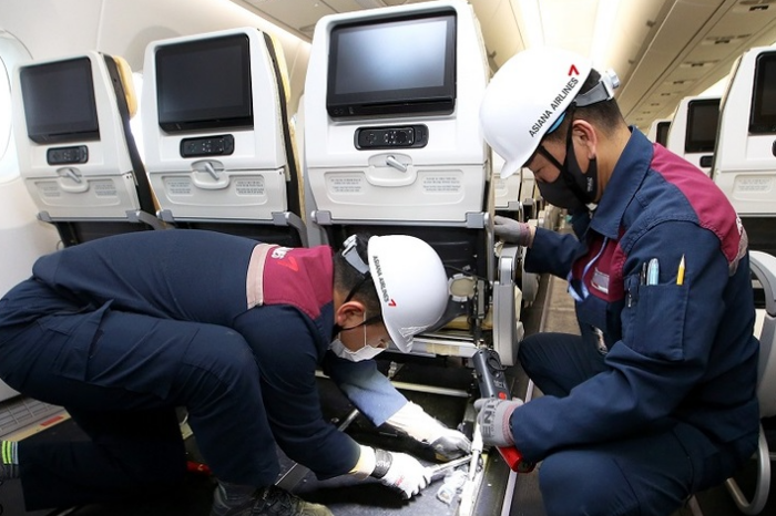 Asiana Airlines workers reinstalling seats on A330 aircraft
