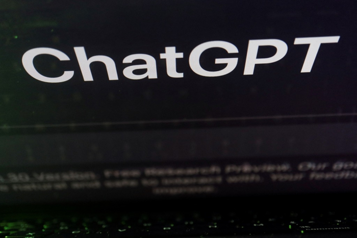 A keyboard is seen reflected on a computer screen displaying the website of ChatGPT, an AI chatbot from OpenAI, in this picture taken Feb. 8, 2023 (Courtesy of Reuters/Yonhap)