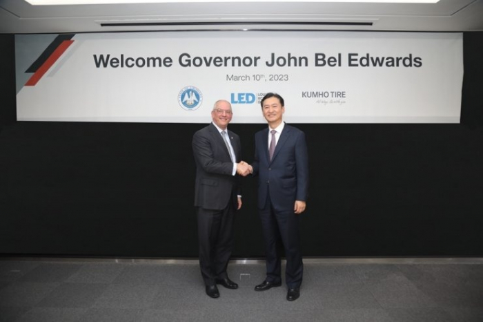 Louisiana Governor John Bel Edwards (left) and Kumho Tire CEO Jung Il-taik