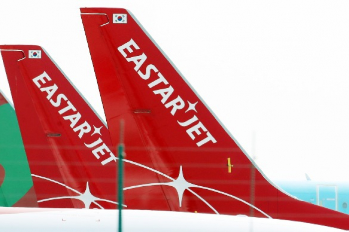 Tails　of　Eastar　Jet　planes　parked　at　Incheon　International　Airport　(Courtesy　of　Yonhap)