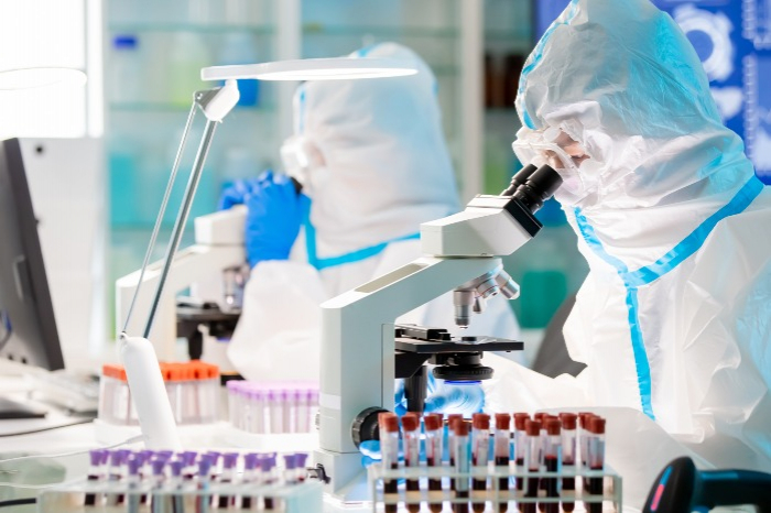 A　biotech　researcher　examines　a　blood　test　(Courtesy　of　Getty　Images)