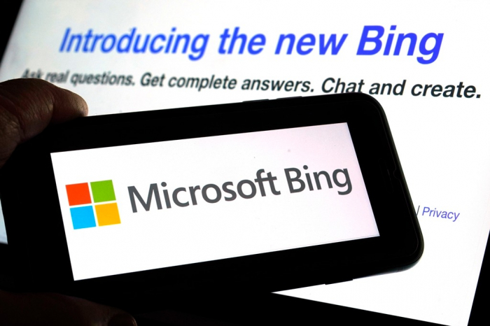 The　Microsoft　Bing　logo　and　the　website's　page　are　shown　in　this　photo　taken　in　New　York　on　Tuesday,　Feb.　7,　2023.　Microsoft　is　fusing　ChatGPT-like　technology　into　its　search　engine　Bing,　transforming　an　internet　service　that　now　trails　far　behind　Google　into　a　new　way　of　communicating　with　artificial　intelligence.　(Courtesy　of　AP/Yonhap)
