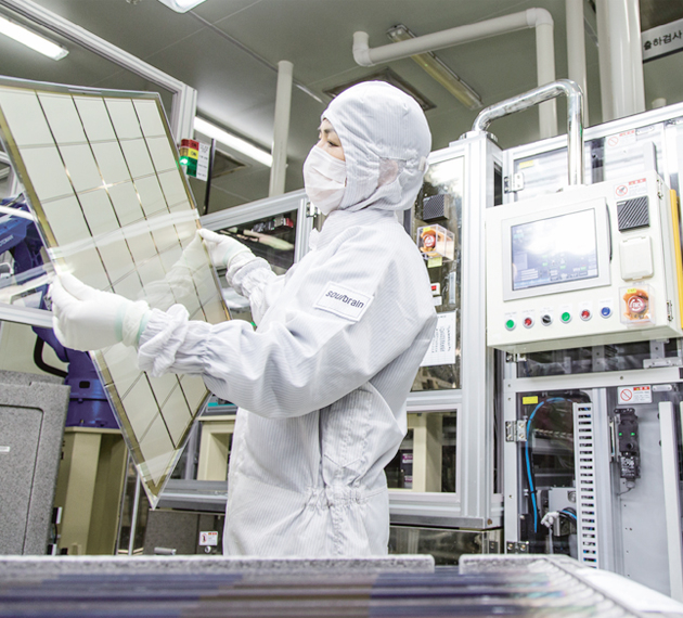 An employee at a Soulbrain factory