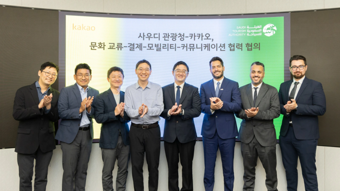Kakao　officials　and　Saudi　Tourism　Authority　executives　such　as　Chief　Marketing　Officer　for　APAC　Alhasan　Aldabbagh　(third　right)　pose　for　a　picture　at　Kakao's　South　Korea　office　on　May　23,　2023　(Courtesy　of　Kakao)