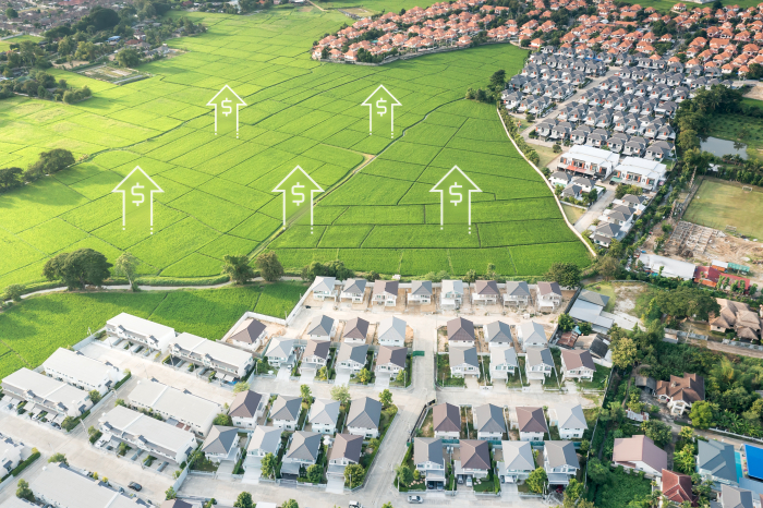 Real estate on a green field (Courtesy of Getty Images)