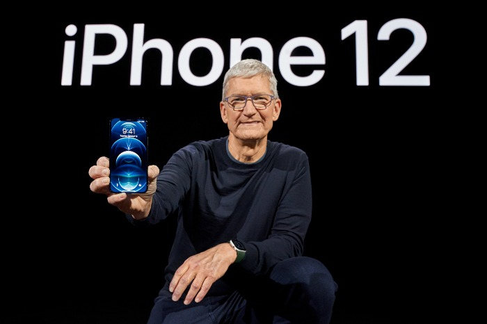 Apple Chief Executive Tim Cook displays the iPhone 12 Pro in 2021