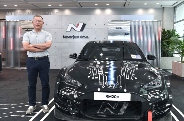 Hyundai Motor Group Chairman Chung Euisun stands next to a Hyundai N brand performance car