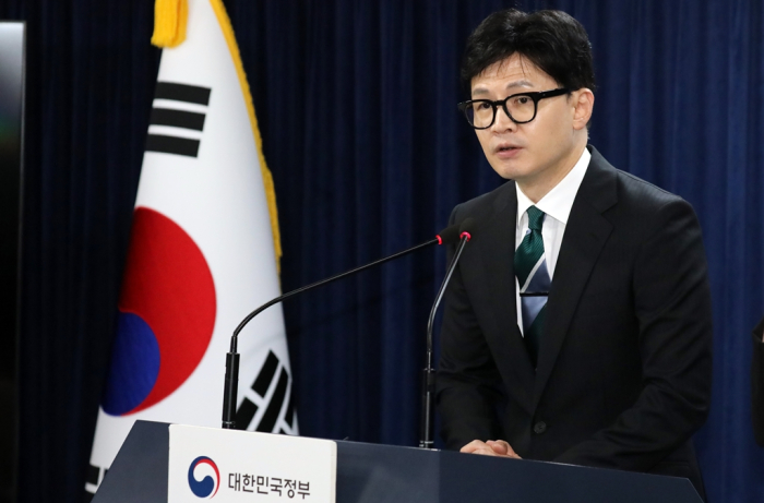 Justice Minister Han Dong-hoon announces a presidential pardon of business leaders on Aug. 14, the day before Liberation Day