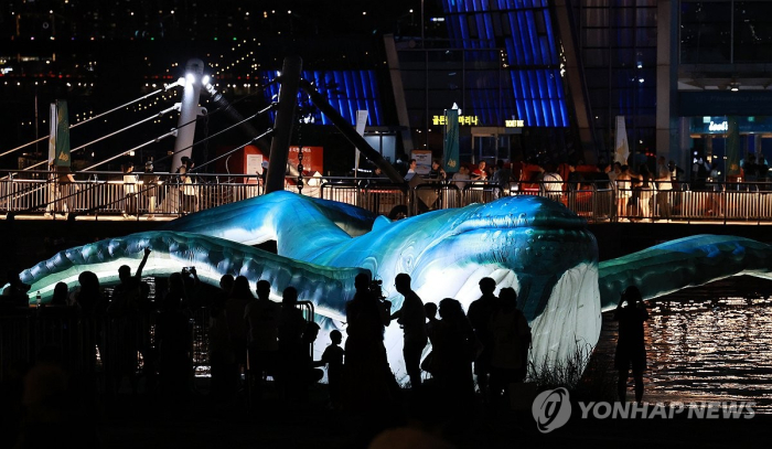 A black whale sculpture, representing creative ideas in the Netflix-hit drama Extraordinary Attorney Woo, at the K-content Festival in Seoul on Sept. 8, 2023 (Courtesy of Yonhap News)