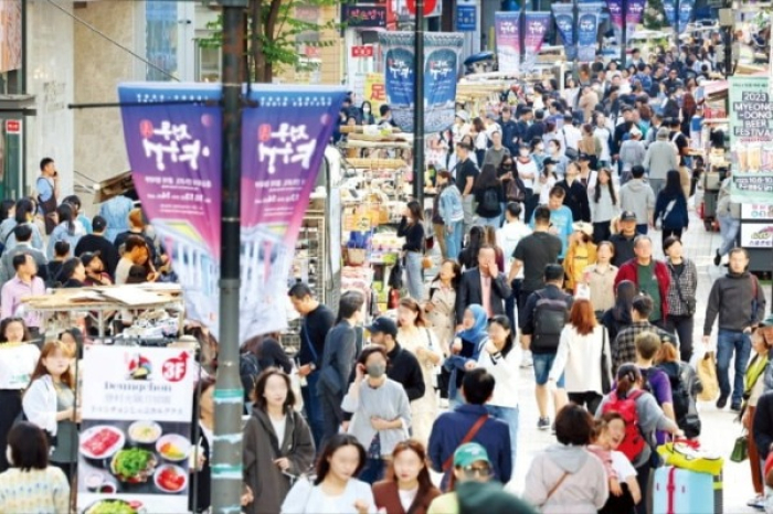 Visitors in Myeongdong, Seoul on Oct. 3, 2023