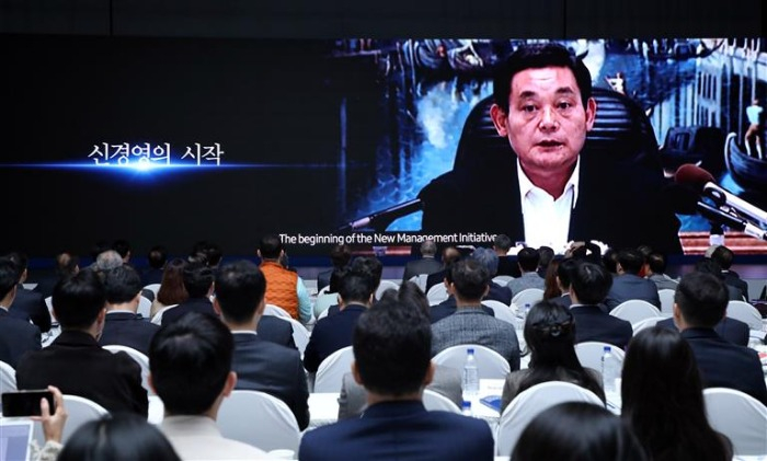 Samsung hosted an international symposium to commemorate the third year since the former Chairman Lee Kun-hee (on-screen) died
